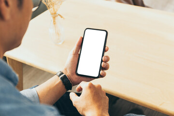 cell phone blank white screen mockup.hand holding texting using mobile on desk at office.background empty space for advertise.work people contact marketing business,technology