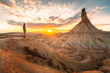 Young adult at famous Castildetierra natural monument at Bardenas Reales desert, Navarra, Basque Country.