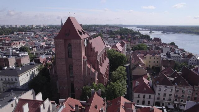 Torun, a Polish city during the day. A sunny and slightly cloudy day in Toruń on the Vistula River.