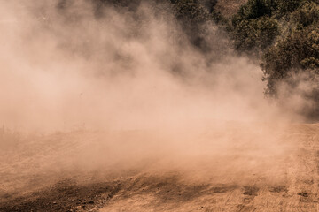 A large dust storm. Powdered dust and sand flowing into air.