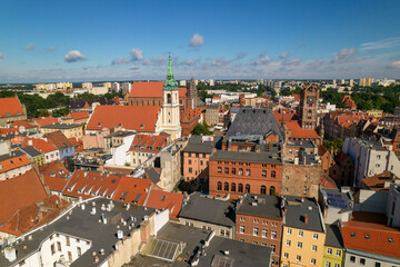 Obraz premium Torun, a Polish city during the day. A sunny and slightly cloudy day in Toruń on the Vistula River.