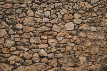 Old mediterranean style stone wall of the house