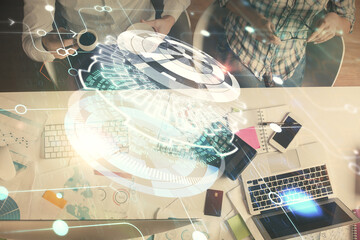 Double exposure of man and woman working together and data theme hologram drawing. Computer background. Top View.