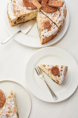 a piece of cake on a white plate, cut  a cake