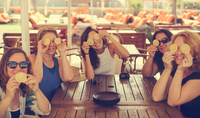 Fototapeta premium Women best friends sitting in summer cafe on the beach