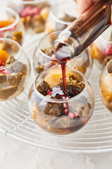 dessert in a glass , poured with sweet syrup