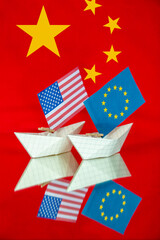 paper ship with Flags of EU Europe union and China - concept for relations between countries, agreement, conflict, political tension	
