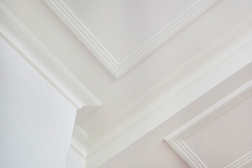 Detail of corner ceiling cornice with intricate crown molding.