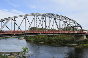 Fototapeta na wymiar iron bridge across the river