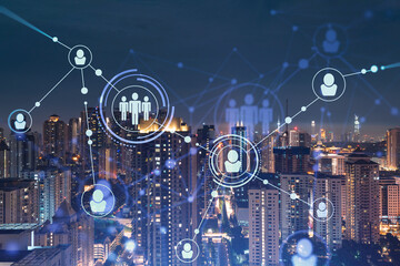 Glowing social media icons on night panoramic city view of Kuala Lumpur, Malaysia, Asia. The concept of networking and establishing new connections between people in businesses in KL. Double exposure.