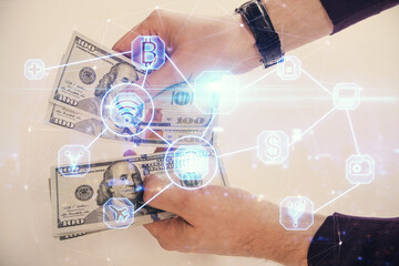 Multi exposure of social network theme drawing hologram and USA dollars bills and man hands.