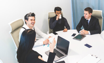 top view Group of young business people working and communicating while sitting at the office desk together with colleagues sitting. business meeting