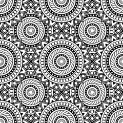 Abstract seamless backdrop. Round texture in black and white colors. Mandala background. Oriental pattern for design and coloring book