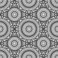 Abstract seamless backdrop. Round texture in black and white colors. Mandala background. Oriental pattern for design and coloring book