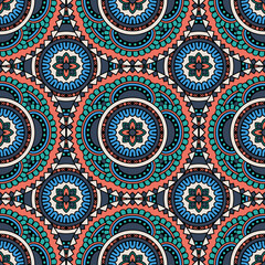Abstract seamless mandala background. Texture in red, blue and turquoise colors. Oriental pattern for design, fashion print, scrapbooking