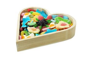 Wooden heart with gummy candies isolated on white background