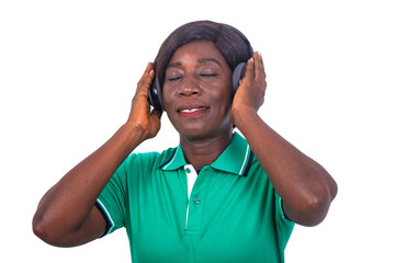 mature woman listening to music with her wireless headphones smiling.