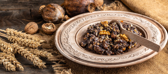 Obraz na płótnie Canvas Kutia ceremonial grain dish with honey, raisins and poppy seeds. traditional meal in eve Christmas