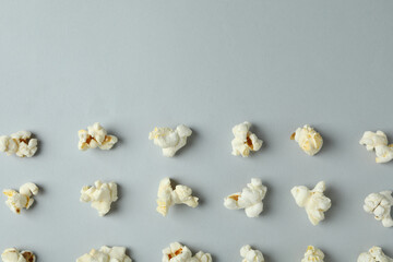 Flat lay with popcorn on light gray background