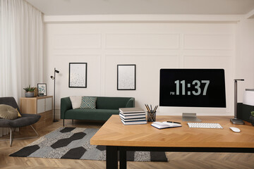 Comfortable workplace with modern computer on wooden desk in room. Interior design