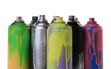 Used cans of spray paints on white background. Graffiti supplies