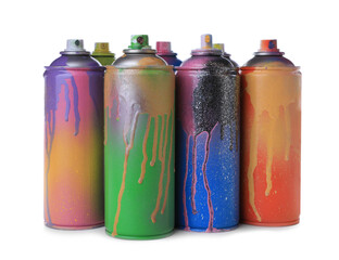 Used cans of spray paints on white background. Graffiti supplies