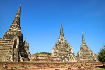 Fototapeta premium Amazing Remains of Medieval Wat Phra Si Sanphet Temple and the Royal Palace, UNESCO World Heritage Site in Ayutthaya, Thailand