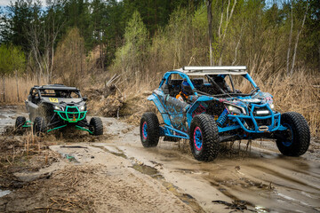 Atv vehicles in muddy water at the quad (buggy) competition