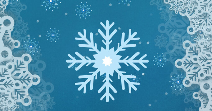 Image of falling snowflakes on blue background