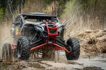 ATV/UTV/4x4 off-road vehicle in muddy water © Antonio