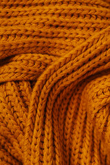 Orange autumn knitting wool texture background.