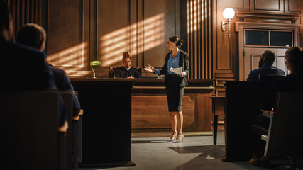 Court of Justice and Law Trial: Successful Female Prosecutor Presenting the Case, Making Passionate Speech to Judge, Jury. Attorney Lawyer Protecting Client with Closing Not Guilty Arguments. - obrazy, fototapety, plakaty