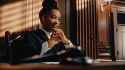 Cinematic Court of Law Trial: Humane Portrait of Impartial Smiling Female Judge Listening Happily to Jury's Verdict. Wise, Incorruptible, Fair Justice Imprisoning Criminals and Protecting The Innocent - obrazy, fototapety, plakaty