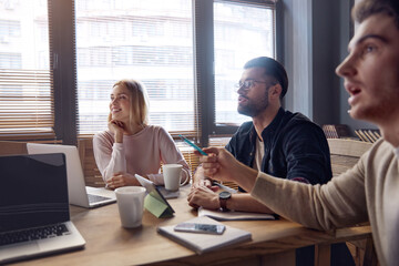 Business team working together at desk in office