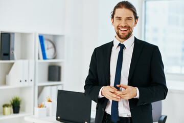 man in a suit in the office with documents executive