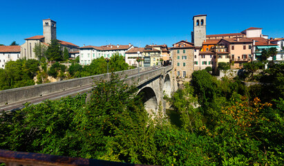 Fototapeta na wymiar Scenic view of ancient arched bridge Ponte del Diavolo across Natisone river in small Italian town of Cividale del Friuli