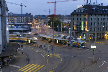 Central square at late summer evening with trams, cars, pedestrians and street lights. Photo taken September 17th, 2021, Zurich, Switzerland.
