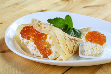Pancake with cottage cheese and jam