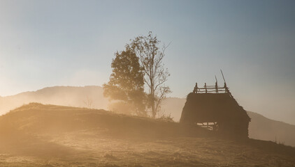 beautiful foggy autumn morning landscape in rural Transylvania