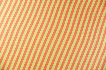 Striped beach towel as background, top view