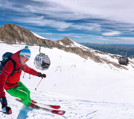 Fototapeta na wymiar Skier skiing downhill during sunny day in high mountains, Kaprun glacier- Zell am see, Austria