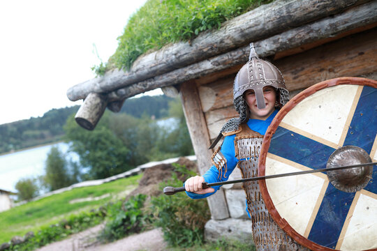 Child posing in Viking Armor with shield