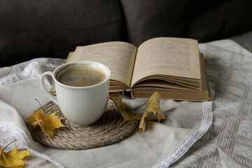 a cup of black coffee and a book