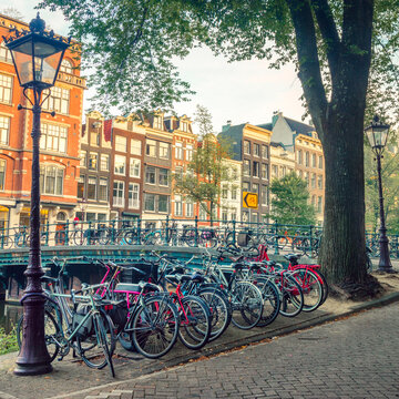 Popular bicycles in Europe. Many bicycles are parked on the street and traditional old European houses. Amsterdam, Netherlands, Holland © Taiga
