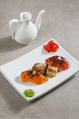 Plate with three sushi on white plate
