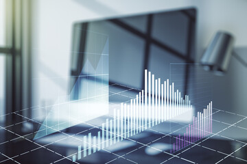 Multi exposure of abstract financial graph on laptop background, financial and trading concept