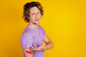 Confident man hand presenting adhesive plaster vaccine advertisement promotion