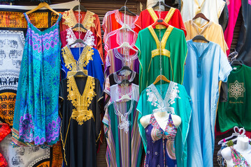 Exhibition of a colorful multitude of traditional dresses, arabic style, Granada, Andalusia, Spain.