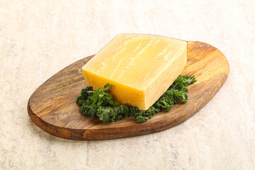 Parmesan cheese piece over board