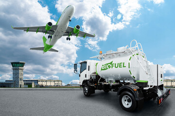 Airplane and truck with biofuel tank on the background of airport. New energy sources